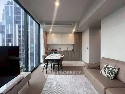 Modern living room with city view and open kitchen layout