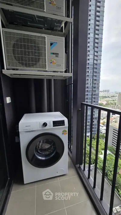 Modern balcony with washing machine and city view in high-rise apartment