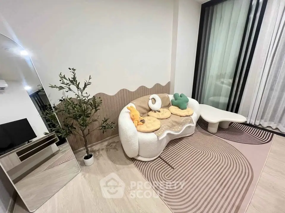 Modern living room with stylish sofa, mirror, and decorative plant, featuring elegant design and cozy ambiance.