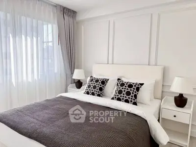 Elegant bedroom with modern decor and natural light