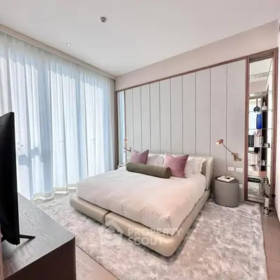 Luxurious modern bedroom with plush bed and elegant decor