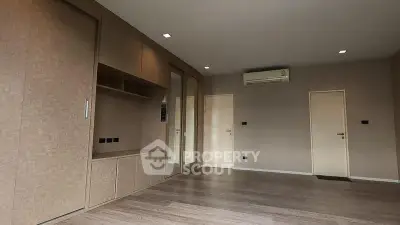 Spacious modern room with built-in storage and air conditioning