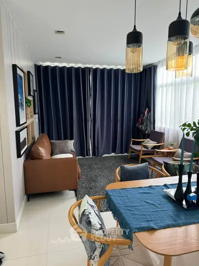 Stylish living room with modern decor, cozy seating, and elegant lighting, perfect for relaxation and entertaining.
