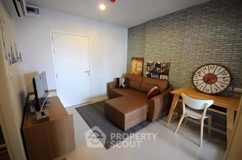 Modern living room with stylish brick accent wall and cozy brown sofa