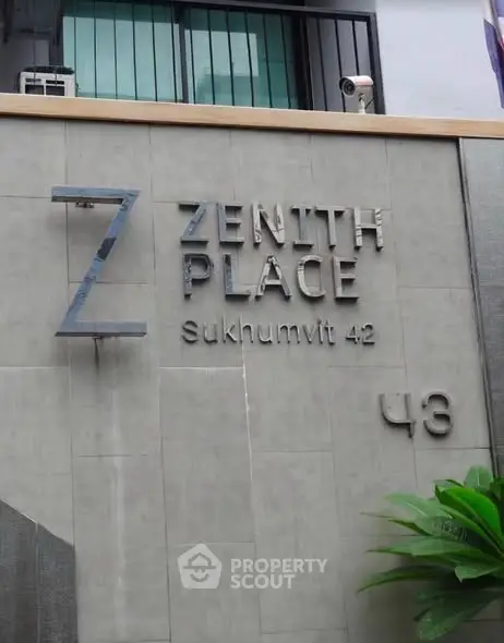 Modern building exterior with stylish signage at Zenith Place Sukhumvit 42.