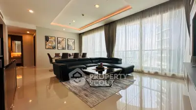 Luxurious modern living room with elegant decor and floor-to-ceiling windows