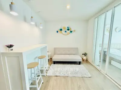Modern living room with minimalist decor and cozy seating area