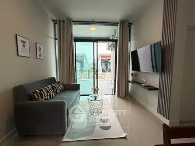 Modern living room with sleek decor and balcony view