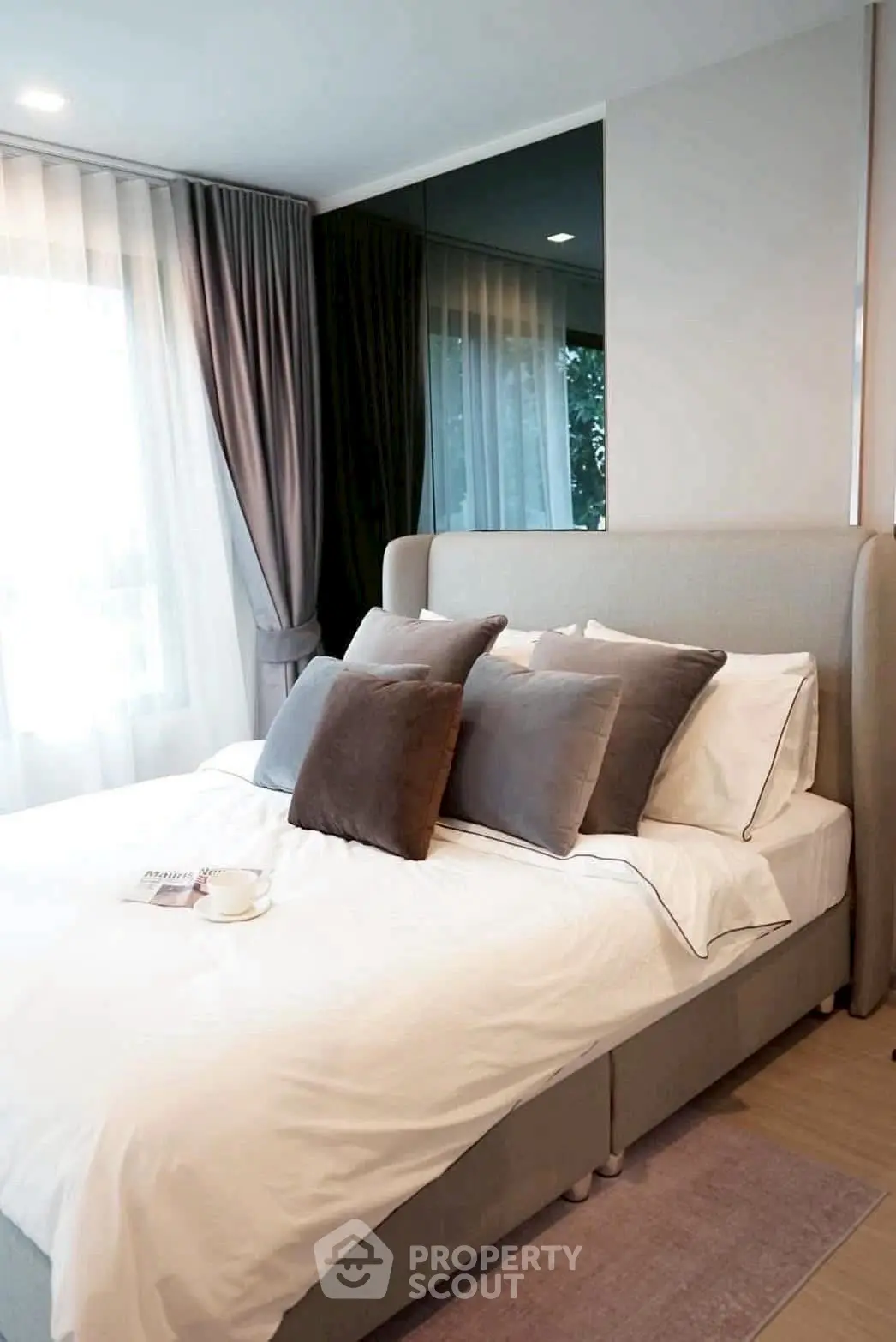 Cozy and elegant bedroom with plush pillows and natural light