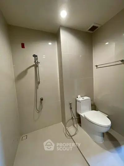 Modern minimalist bathroom with sleek fixtures and neutral tiles