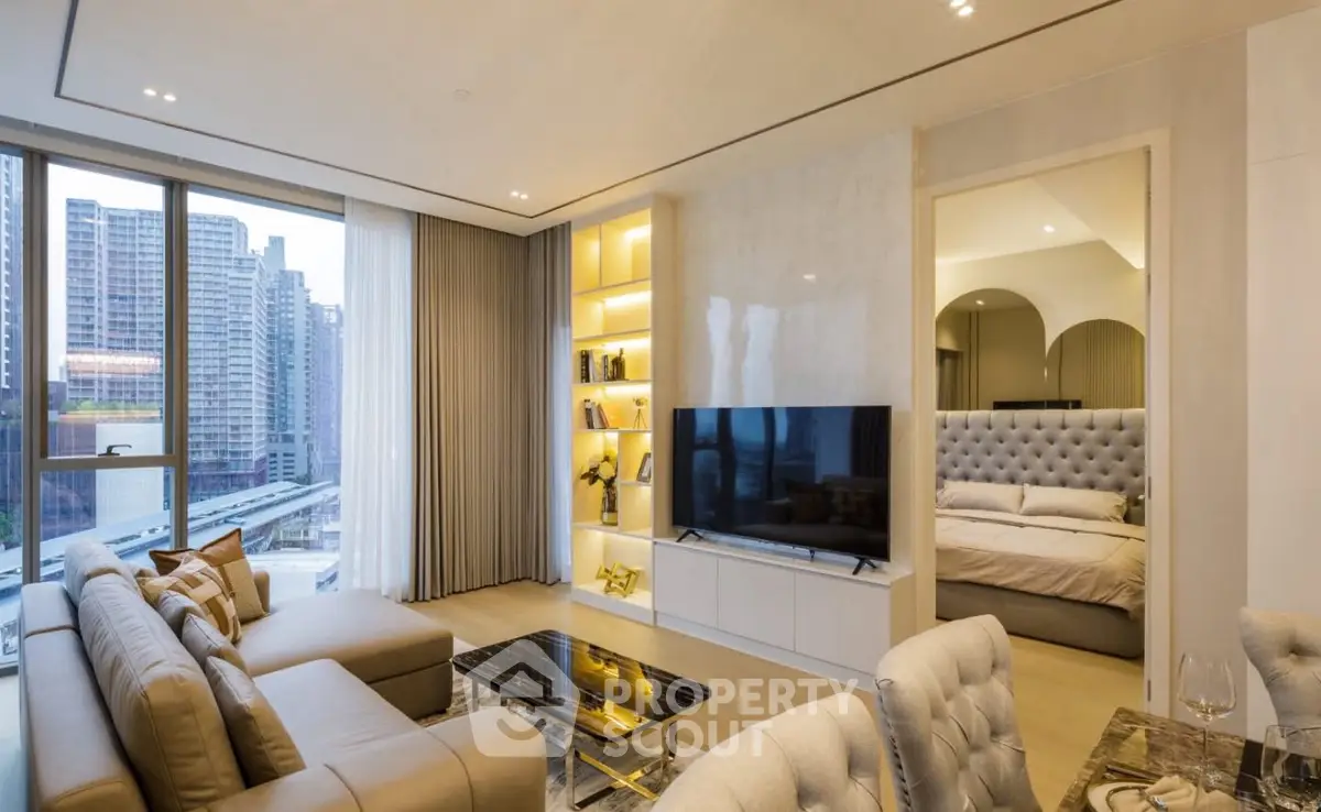 Luxurious modern living room with elegant decor and city view, featuring a cozy bedroom entrance.
