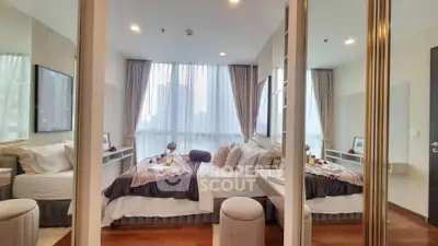 Luxurious bedroom with elegant decor and large windows offering city views
