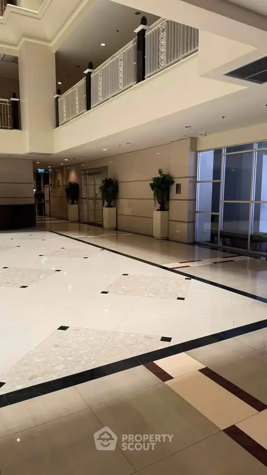 Luxurious building lobby with elegant marble flooring and modern design.