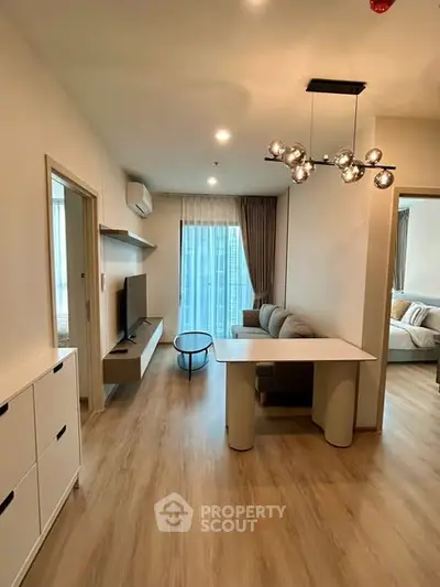 Modern living room with stylish lighting and cozy seating area