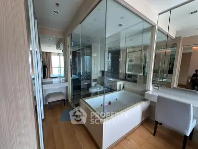 Luxurious bathroom with glass-enclosed bathtub and modern design