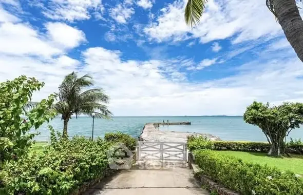 Stunning oceanfront view with lush garden and private pier access