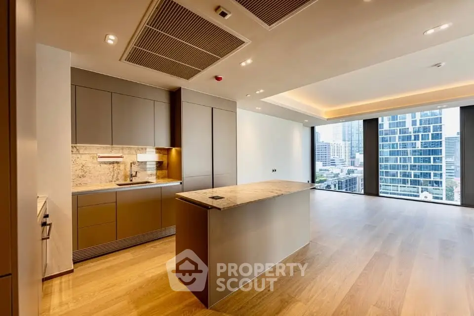 Luxurious open-plan kitchen with city view in modern apartment