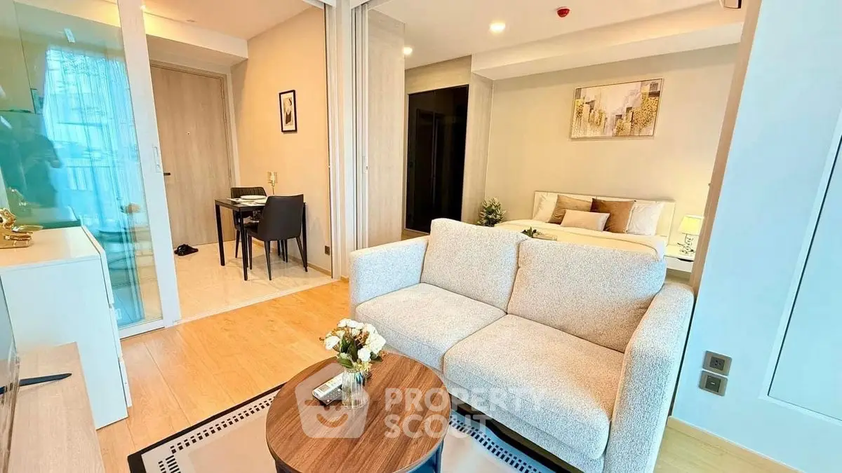Modern open-plan living room with cozy sofa and stylish decor
