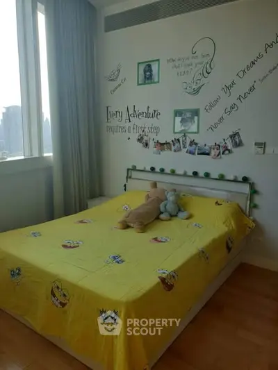 Charming bedroom with city view and playful decor, perfect for a child's room.