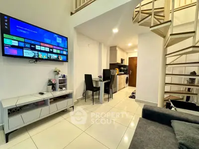 Modern duplex living room with spiral staircase and open kitchen layout