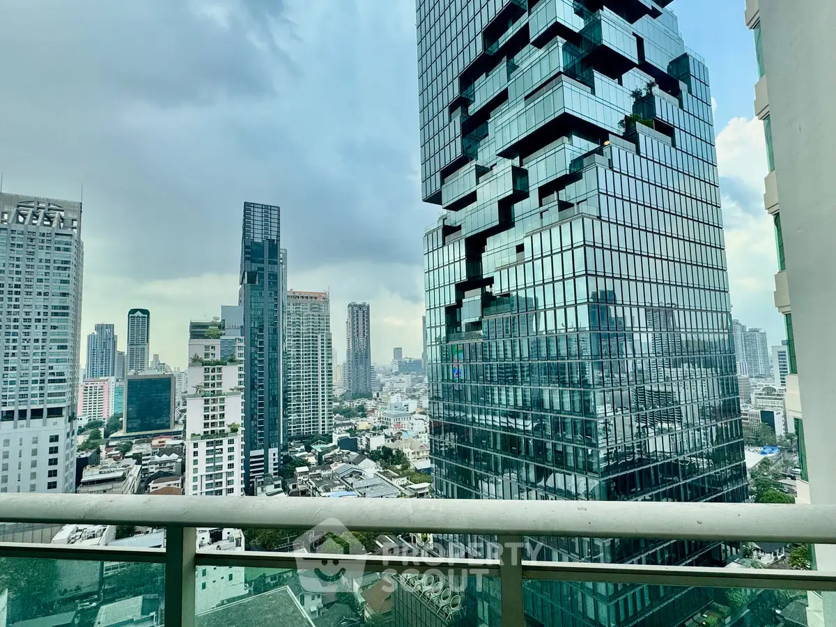 Stunning cityscape view from a high-rise balcony showcasing modern architecture and skyline.