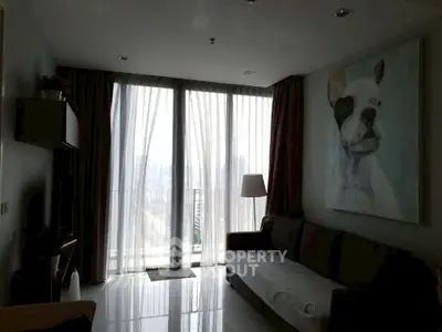 Stylish living room with large windows and dog painting, offering a bright and modern ambiance.