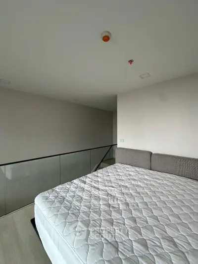 Modern minimalist bedroom with sleek design and comfortable bedding