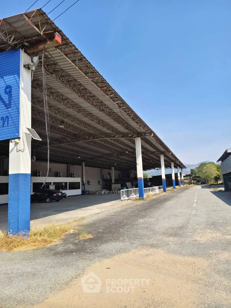 Spacious industrial warehouse with ample parking and high ceilings