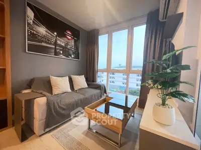 Modern living room with large windows and stylish decor