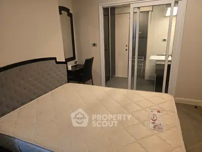 Cozy bedroom with ensuite bathroom and modern furnishings