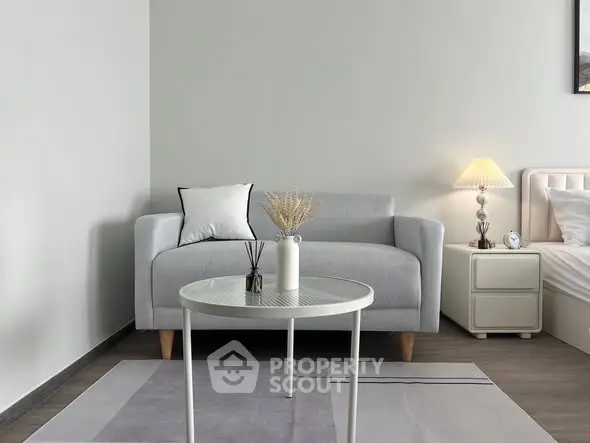Modern living room with stylish grey sofa and elegant decor