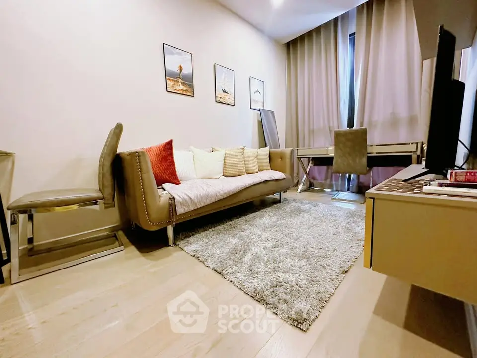 Stylish living room with modern decor, cozy sofa, and elegant workspace, perfect for urban living.