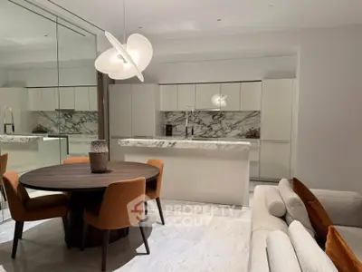 Modern kitchen with marble countertops and stylish dining area in luxury apartment