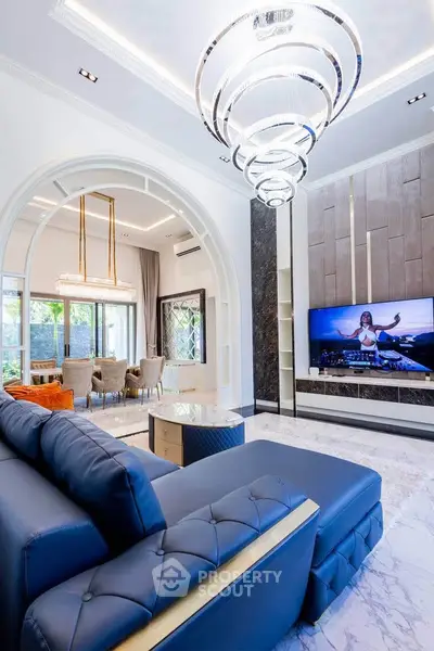 Luxurious living room with elegant chandelier and modern decor