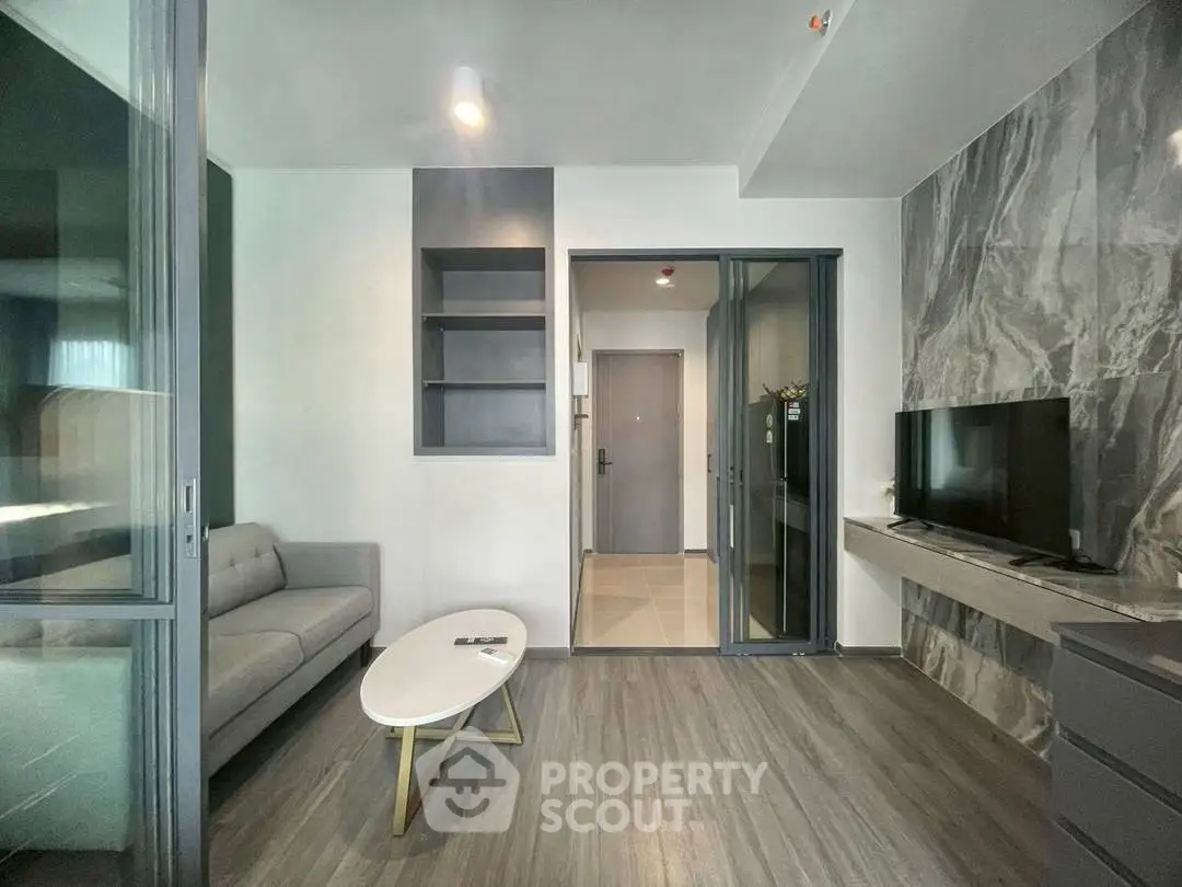 Modern living room with sleek design and stylish furniture in a contemporary apartment.