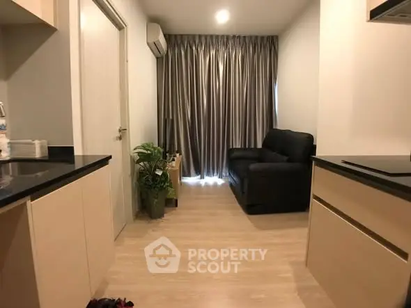 Modern living room with sleek design and cozy black sofa