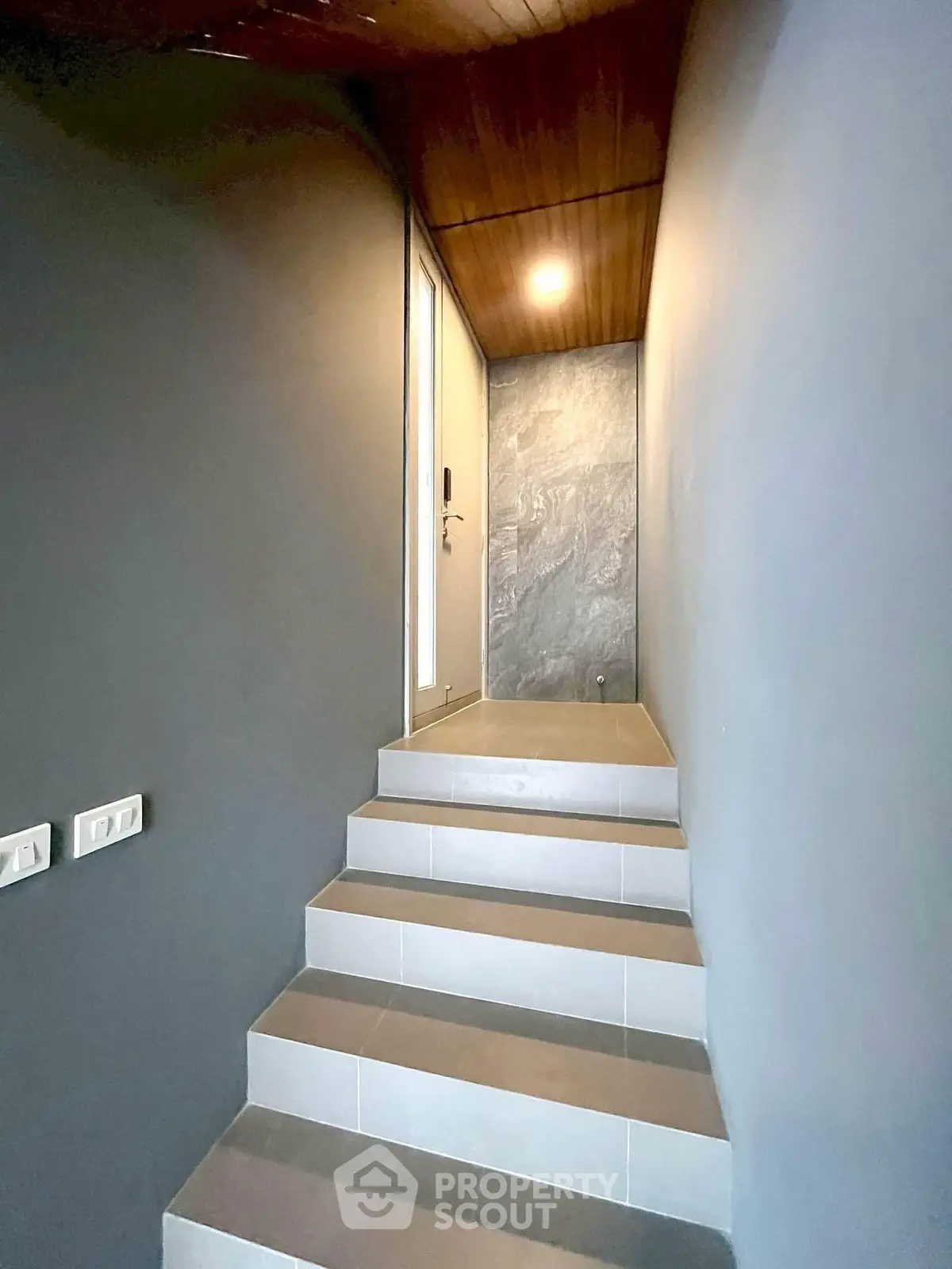 Modern minimalist staircase with sleek design and ambient lighting