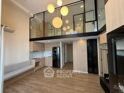 Modern loft apartment with stylish lighting and open kitchen layout