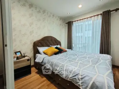Cozy bedroom with stylish decor and natural light, perfect for relaxation and comfort.