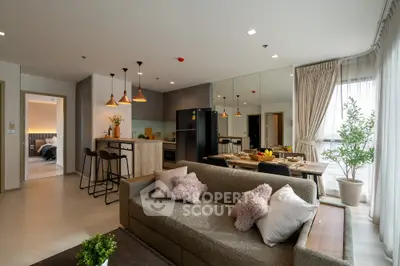 Spacious modern living room with open kitchen and stylish decor