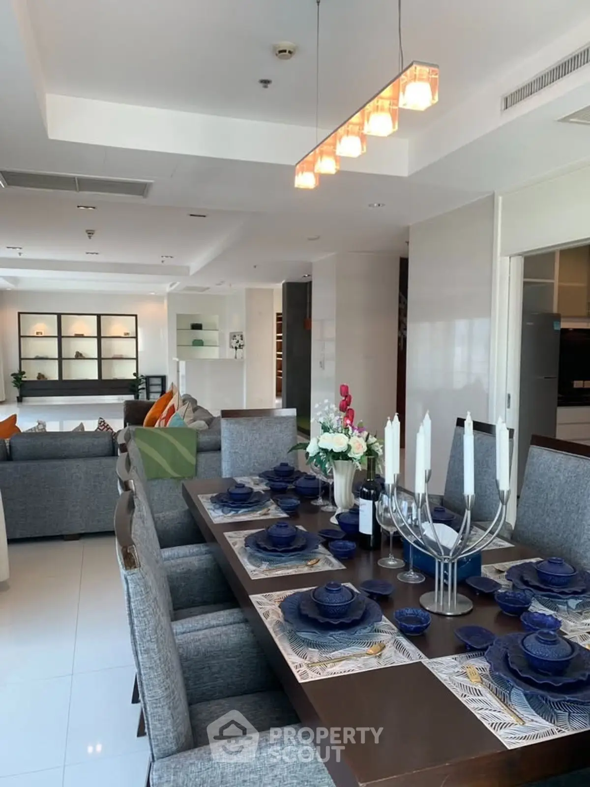 Luxurious open-plan living and dining area with elegant decor and modern furnishings.