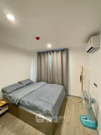 Cozy bedroom with modern decor and natural light