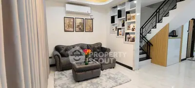 Stylish living room with modern decor and elegant staircase