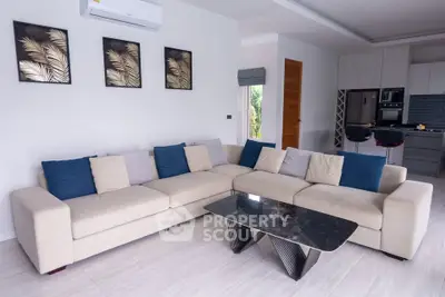 Modern living room with stylish decor and open kitchen layout