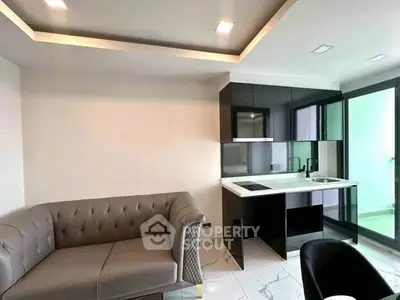 Modern living room with sleek kitchen and stylish sofa in open layout