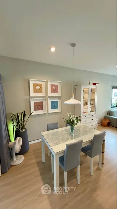 Stylish dining area with modern decor and elegant lighting in a cozy living space.