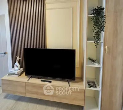 Modern living room with sleek TV stand and decorative shelving