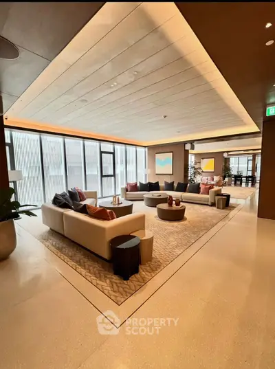 Luxurious modern living room with elegant sofas and stylish decor in a spacious open layout.