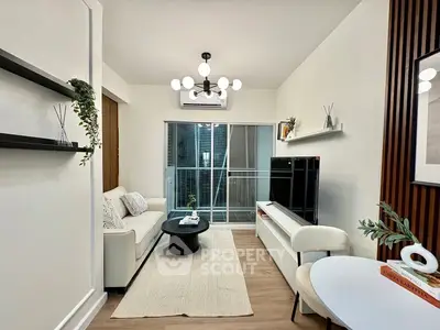 Modern living room with stylish decor and balcony access