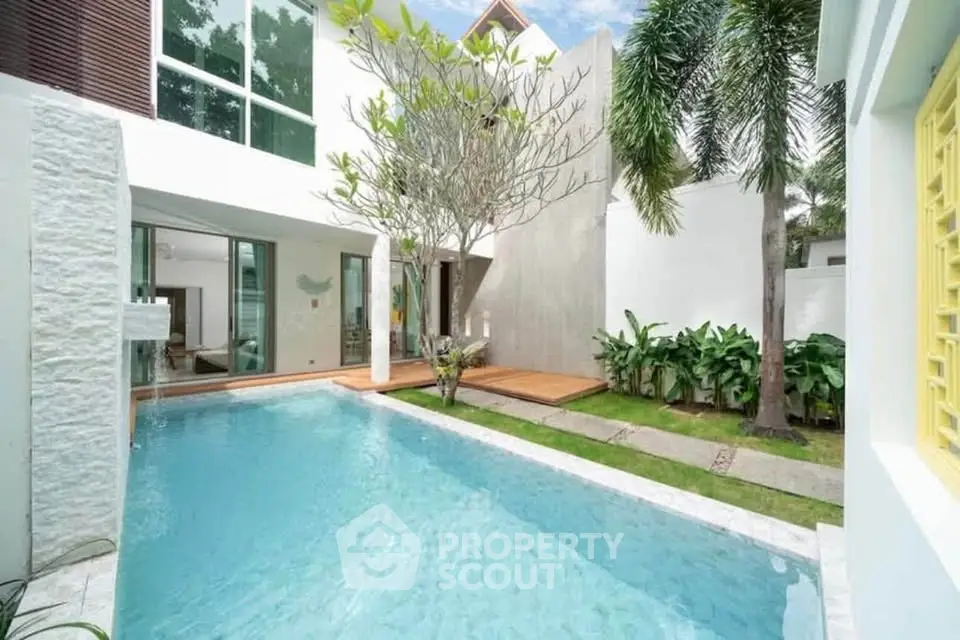 Luxurious modern home with private pool and lush garden, perfect for relaxation and entertaining.